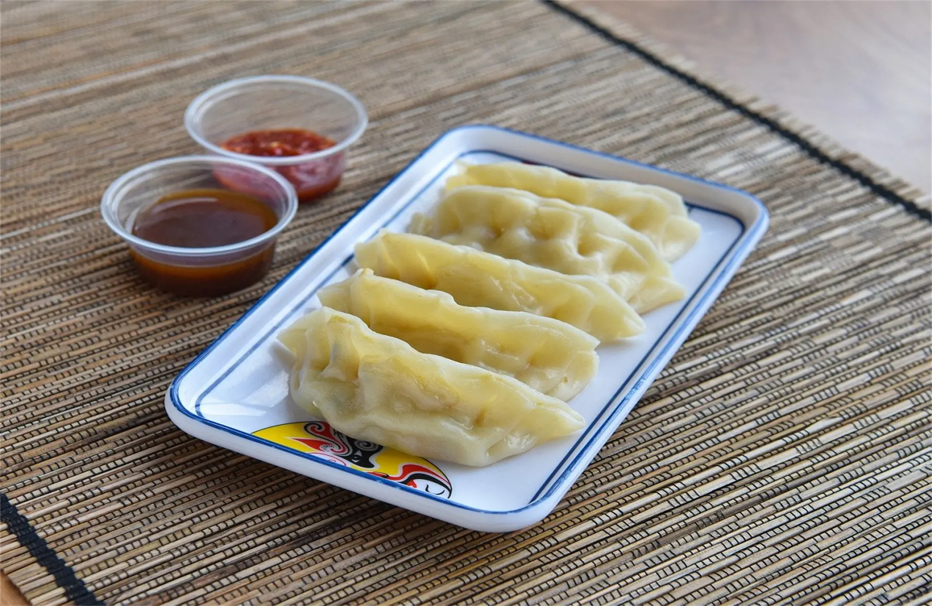 Delicious steam dumplings with two sauces, a Chinese Restaurant in USA